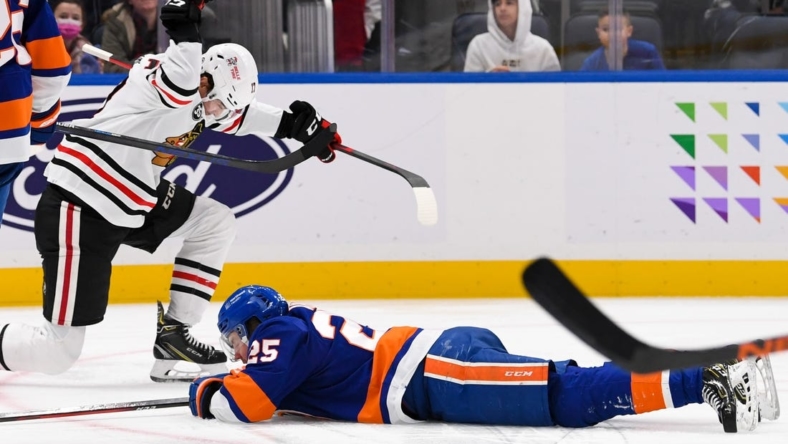 Dec 5, 2021; Elmont, New York, USA; Chicago Blackhawks center Dylan Strome (17) celebrates his goal against the New York Islanders during the third period  at UBS Arena. Mandatory Credit: Dennis Schneidler-USA TODAY Sports