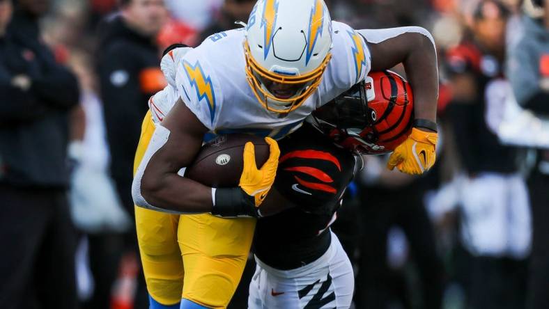 Dec 5, 2021; Cincinnati, Ohio, USA; Los Angeles Chargers tight end Donald Parham Jr. (89) runs with the ball against Cincinnati Bengals cornerback Chidobe Awuzie (22) in the first half at Paul Brown Stadium. Mandatory Credit: Katie Stratman-USA TODAY Sports