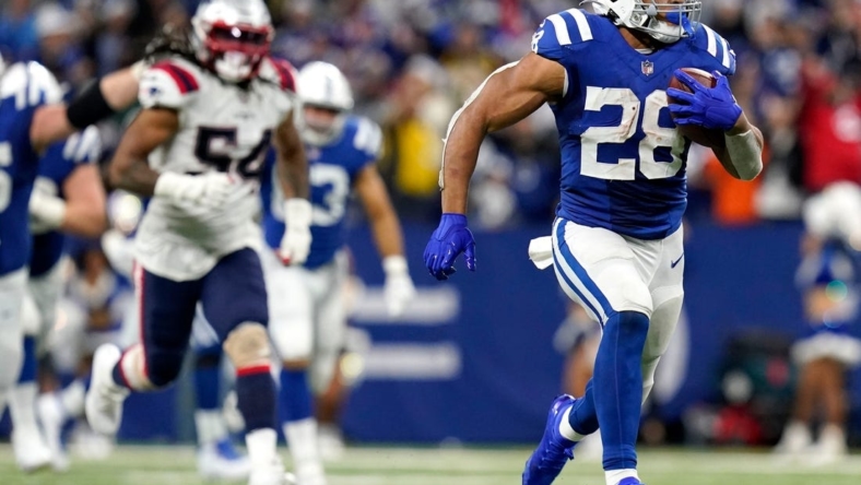 Colts running back Jonathan Taylor breaks away from the Patriots defense on his fourth-quarter touchdown run.

Syndication The Indianapolis Star