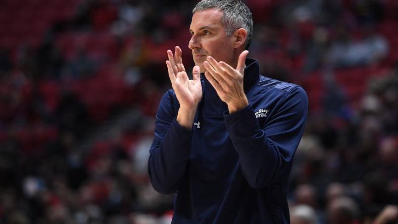 Dec 22, 2021; San Diego, California, USA; UC San Diego Tritons head coach Eric Olen applauds during the first half against the San Diego State Aztecs at Viejas Arena. Mandatory Credit: Orlando Ramirez-USA TODAY Sports