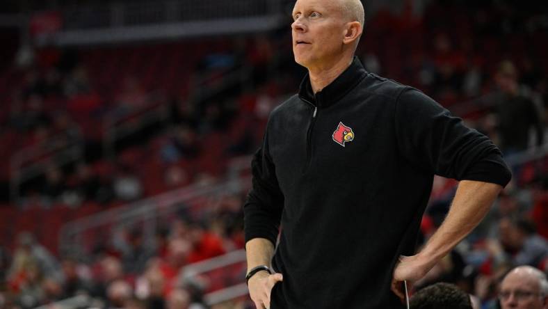 Jan 19, 2022; Louisville, Kentucky, USA;  Louisville Cardinals head coach Chris Mack looks on during the second half against Boston College Eagles at KFC Yum! Center. Louisville defeated Boston College 67-54. Mandatory Credit: Jamie Rhodes-USA TODAY Sports