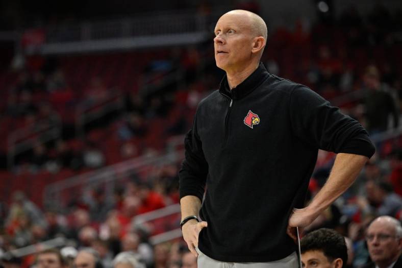 Jan 19, 2022; Louisville, Kentucky, USA;  Louisville Cardinals head coach Chris Mack looks on during the second half against Boston College Eagles at KFC Yum! Center. Louisville defeated Boston College 67-54. Mandatory Credit: Jamie Rhodes-USA TODAY Sports