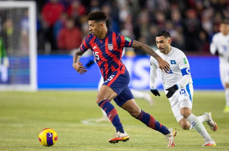 Jan 27, 2022; Columbus, Ohio, USA; United States defender Chris Richards (15) dribbles the ball while El Salvador midfielder Alexander Roldan (15) defends during a CONCACAF FIFA World Cup Qualifier soccer match at Lower.com Field. Mandatory Credit: Trevor Ruszkowski-USA TODAY Sports