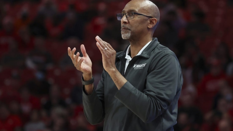 Feb 12, 2022; Houston, Texas, USA; UCF Knights head coach Johnny Dawkins watches play against the Houston Cougars in the second half at Fertitta Center.  Mandatory Credit: Thomas Shea-USA TODAY Sports