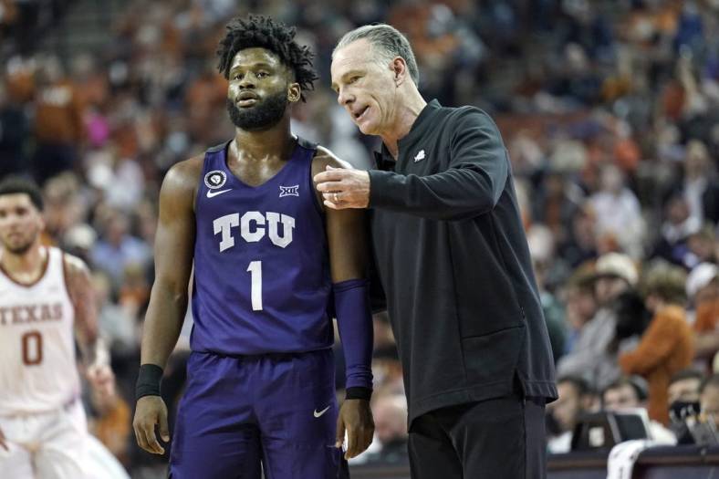 Feb 23, 2022; Austin, Texas, USA; Texas Christian Horned Frogs head coach Jamie Dixon talks with guard Mike Miles Jr. (1) during the second half at Frank C. Erwin Jr. Center. Mandatory Credit: Scott Wachter-USA TODAY Sports