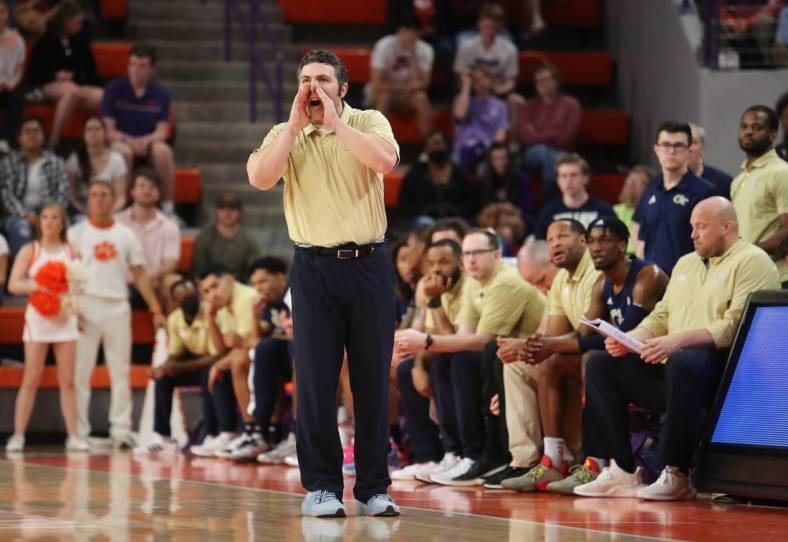 Mar 2, 2022; Clemson, South Carolina, USA; Georgia Tech Yellow Jackets head coach Josh Pastner (front) reacts during the first half against the Clemson Tigers at Littlejohn Coliseum. Mandatory Credit: Dawson Powers-USA TODAY Sports
