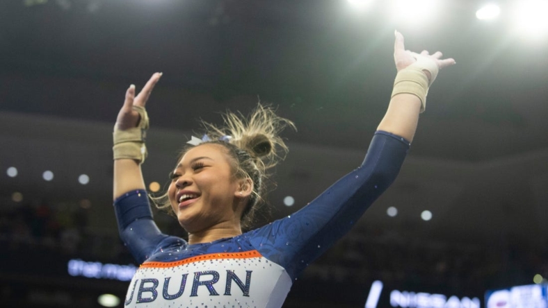 Auburn's Suni Lee reacts after her vault performance as Auburn Tigers gymnastics takes on Florida Gators at Neville Arena in Auburn, Ala., on Saturday, March 5, 2022. Auburn Tigers and Florida Gators ended in a tie at 198.575.