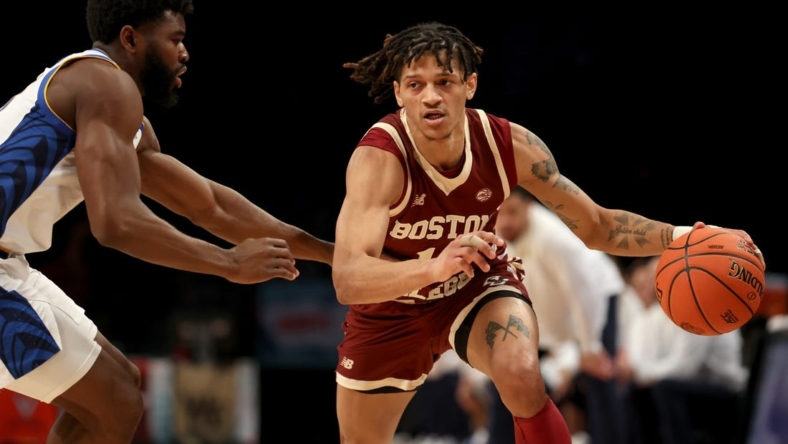 Mar 8, 2022; Brooklyn, NY, USA; Boston College Eagles guard Makai Ashton-Langford (11) controls the ball against Pittsburgh Panthers guard Onyebuchi Ezeakudo (31) during the second half at Barclays Center. Mandatory Credit: Brad Penner-USA TODAY Sports