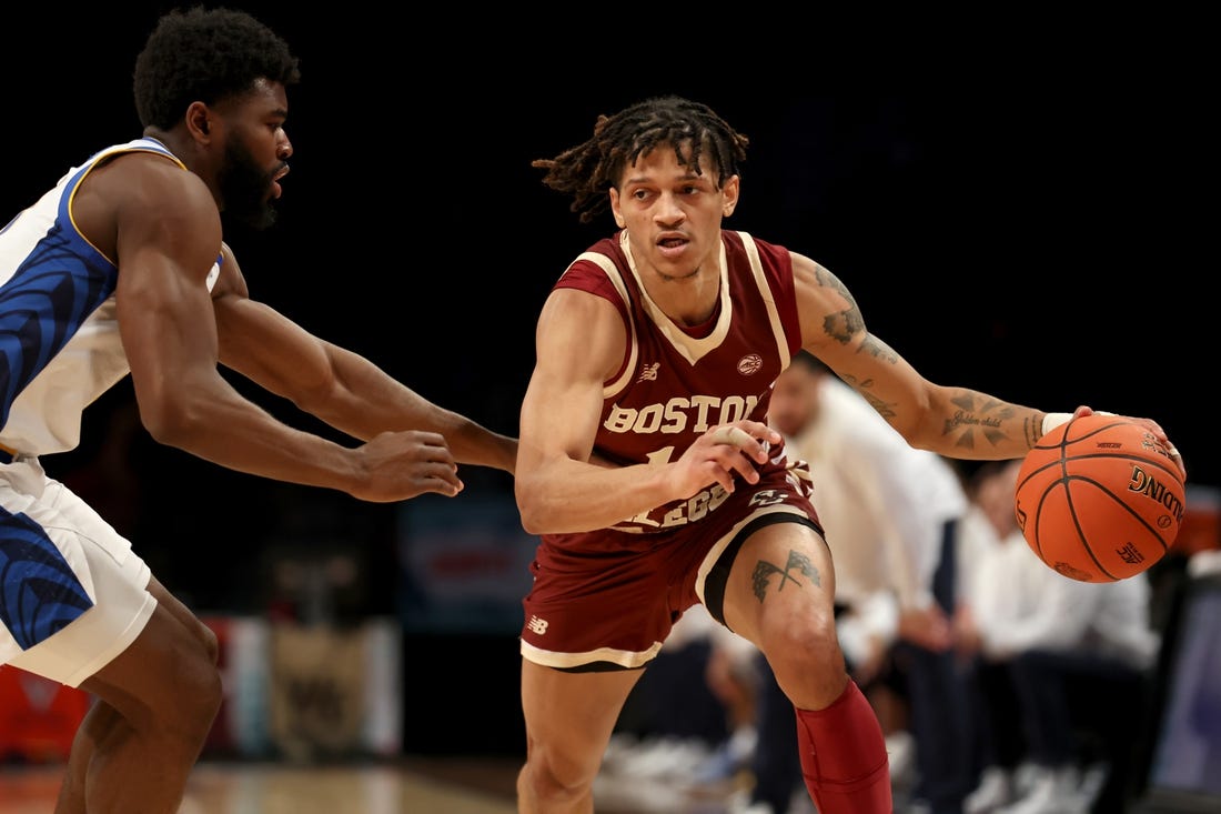 Mar 8, 2022; Brooklyn, NY, USA; Boston College Eagles guard Makai Ashton-Langford (11) controls the ball against Pittsburgh Panthers guard Onyebuchi Ezeakudo (31) during the second half at Barclays Center. Mandatory Credit: Brad Penner-USA TODAY Sports