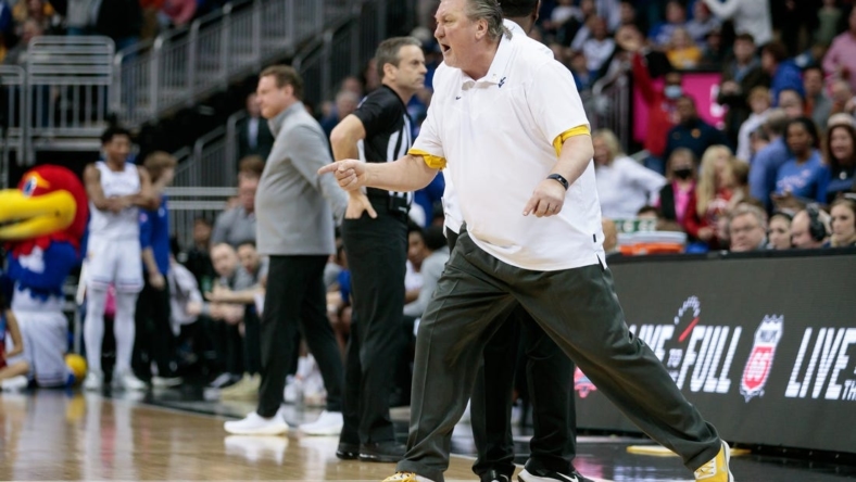 Mar 10, 2022; Kansas City, MO, USA; West Virginia Mountaineers head coach Bob Huggins speaks to referees after being ejected from the game during the first half against the Kansas Jayhawks at T-Mobile Center. Mandatory Credit: William Purnell-USA TODAY Sports