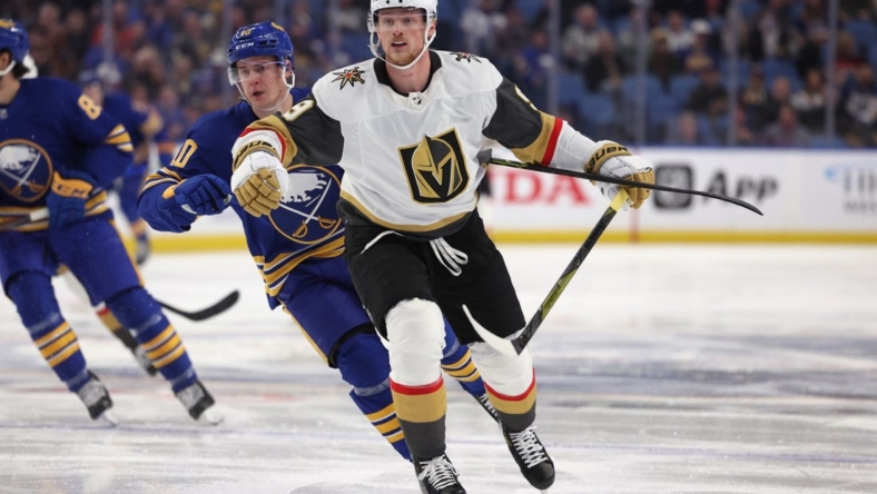 Mar 10, 2022; Buffalo, New York, USA;  Vegas Golden Knights center Jack Eichel (9) goes after a loose puck during the first period against the Buffalo Sabres at KeyBank Center. Mandatory Credit: Timothy T. Ludwig-USA TODAY Sports