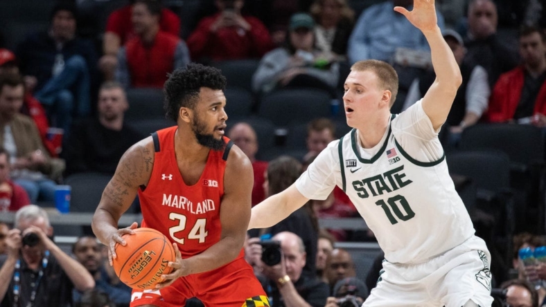 Mar 10, 2022; Indianapolis, IN, USA; Maryland Terrapins forward Donta Scott (24) controls the ball the ball while Michigan State Spartans forward Joey Hauser (10) defends in the second half at Gainbridge Fieldhouse. Mandatory Credit: Trevor Ruszkowski-USA TODAY Sports