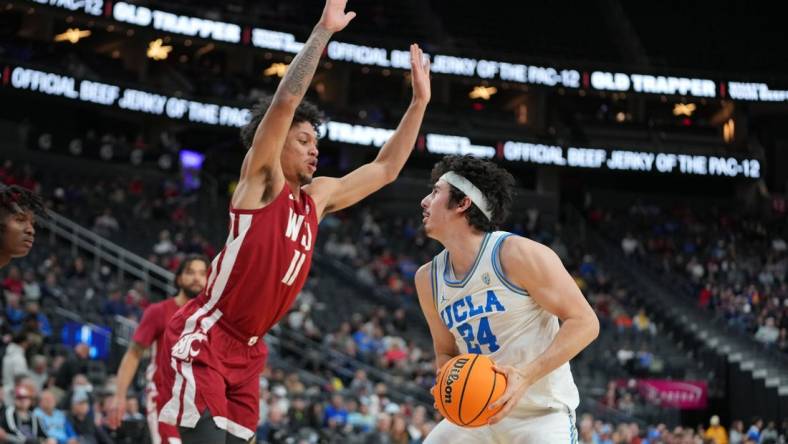 Mar 10, 2022; Las Vegas, NV, USA; Washington State Cougars forward DJ Rodman (11) defends against UCLA Bruins guard Jaime Jaquez Jr. (24) during the first half at T-Mobile Arena. Mandatory Credit: Stephen R. Sylvanie-USA TODAY Sports