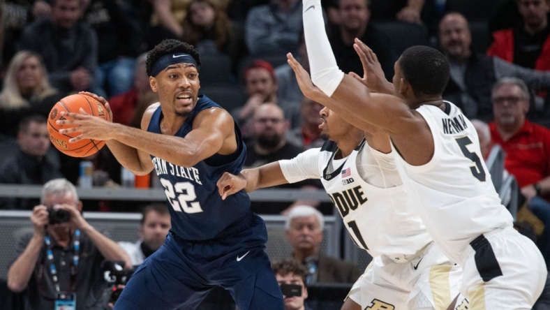 Mar 11, 2022; Indianapolis, IN, USA; Penn State Nittany Lions guard Jalen Pickett (22) looks to pass the ball while Purdue Boilermakers players defend in the second half at Gainbridge Fieldhouse. Mandatory Credit: Trevor Ruszkowski-USA TODAY Sports