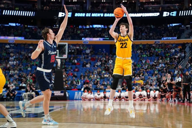 Mar 17, 2022; Buffalo, NY, USA; Iowa Hawkeyes forward Patrick McCaffery (22) shoots the ball against Richmond Spiders forward Matt Grace (15) in the second half during the first round of the 2022 NCAA Tournament at KeyBank Center. Mandatory Credit: Gregory Fisher-USA TODAY Sports