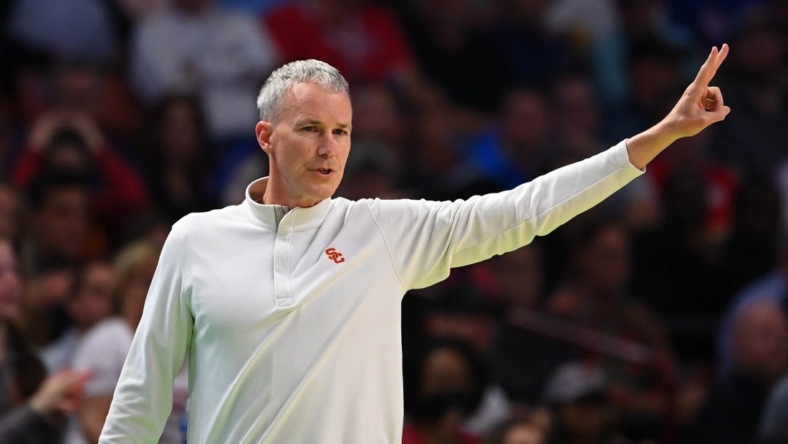 Mar 18, 2022; Greenville, SC, USA;  Southern California Trojans head coach Andy Enfield gestures against the Miami Hurricanes during the first round of the 2022 NCAA Tournament at Bon Secours Wellness Arena. Mandatory Credit: Bob Donnan-USA TODAY Sports