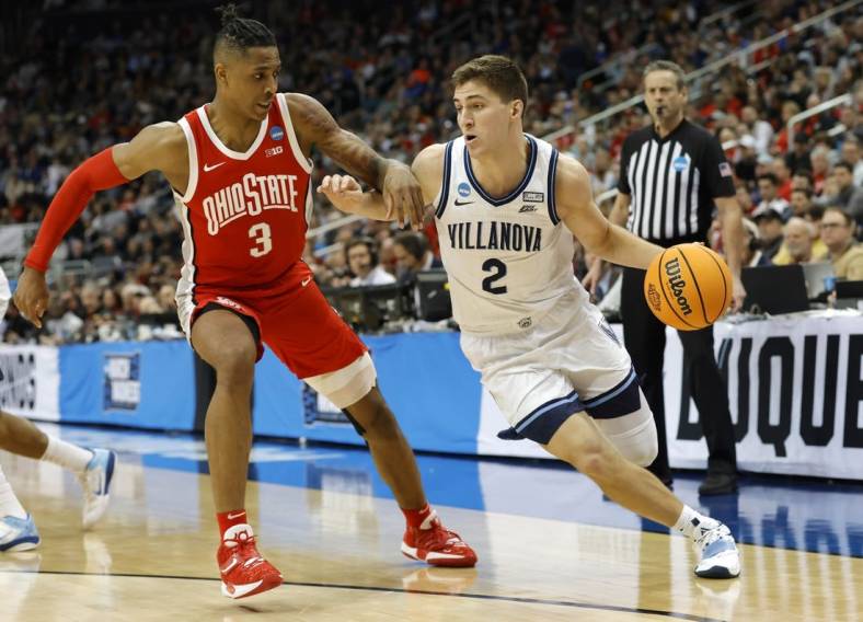 Mar 20, 2022; Pittsburgh, PA, USA; Villanova Wildcats guard Collin Gillespie (2) dribbles the ball past Ohio State Buckeyes guard Eugene Brown III (3) in the second half during the second round of the 2022 NCAA Tournament at PPG Paints Arena. Mandatory Credit: Geoff Burke-USA TODAY Sports