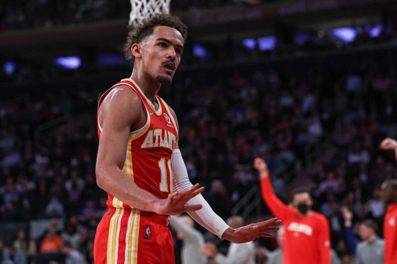 Mar 22, 2022; New York, New York, USA; Atlanta Hawks guard Trae Young (11) gestures towards the crowd during the first half against the New York Knicks at Madison Square Garden. Mandatory Credit: Vincent Carchietta-USA TODAY Sports