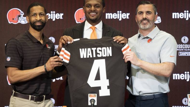 Mar 25, 2022; Berea, OH, USA;  Cleveland Browns quarterback Deshaun Watson poses for a photo with general manager Andrew Berry, left and head coach Kevin Stefanski, right during a press conference at the CrossCountry Mortgage Campus. Mandatory Credit: Ken Blaze-USA TODAY Sports