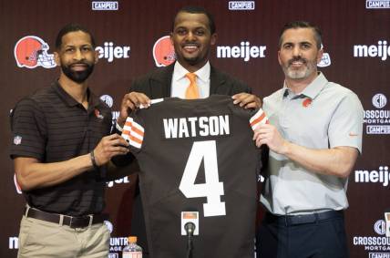 Mar 25, 2022; Berea, OH, USA;  Cleveland Browns quarterback Deshaun Watson poses for a photo with general manager Andrew Berry, left and head coach Kevin Stefanski, right during a press conference at the CrossCountry Mortgage Campus. Mandatory Credit: Ken Blaze-USA TODAY Sports
