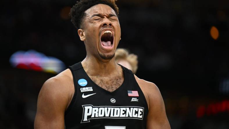 Mar 25, 2022; Chicago, IL, USA; Providence Friars forward Ed Croswell (5) reacts after making a basket while being fouled during the second half against the Kansas Jayhawks in the semifinals of the Midwest regional of the men's college basketball NCAA Tournament at United Center. Mandatory Credit: Jamie Sabau-USA TODAY Sports