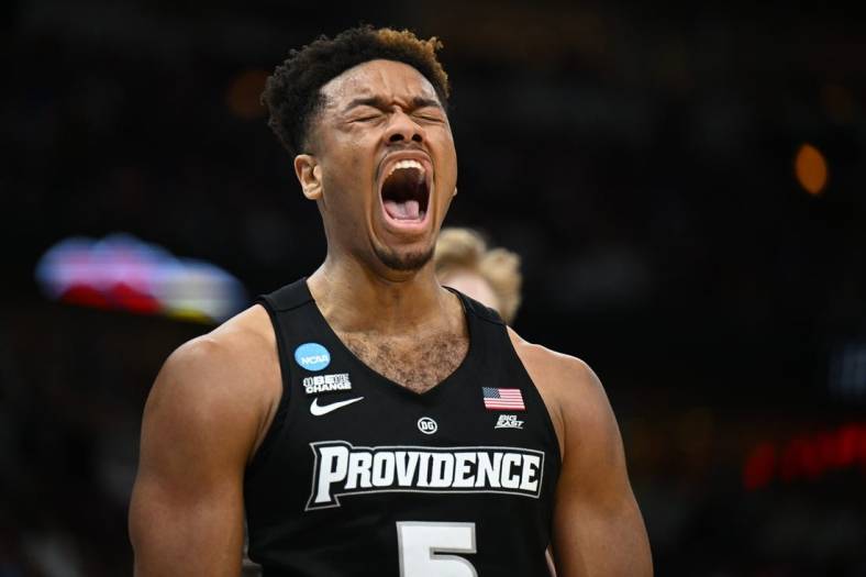 Mar 25, 2022; Chicago, IL, USA; Providence Friars forward Ed Croswell (5) reacts after making a basket while being fouled during the second half against the Kansas Jayhawks in the semifinals of the Midwest regional of the men's college basketball NCAA Tournament at United Center. Mandatory Credit: Jamie Sabau-USA TODAY Sports