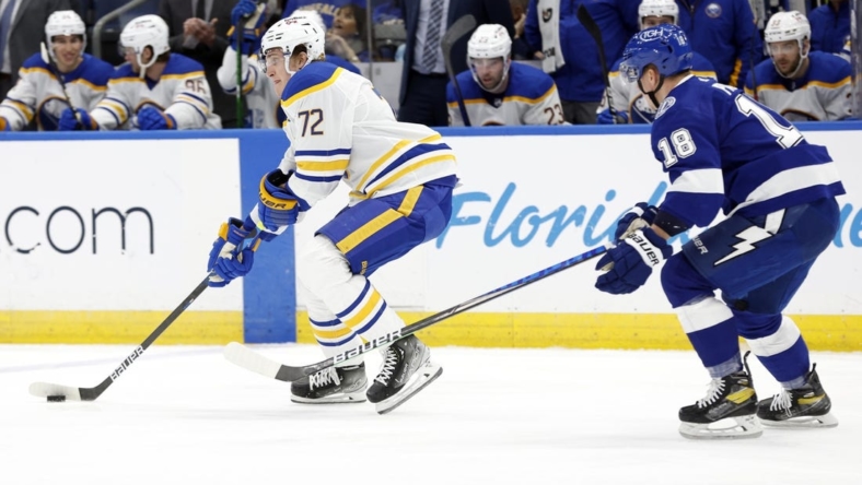 Apr 10, 2022; Tampa, Florida, USA; Buffalo Sabres right wing Tage Thompson (72) skates with the puck as Tampa Bay Lightning left wing Ondrej Palat (18) defends during the first period at Amalie Arena. Mandatory Credit: Kim Klement-USA TODAY Sports