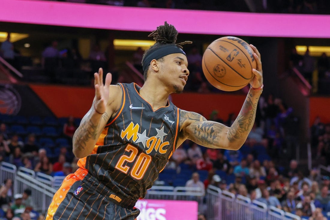 Apr 10, 2022; Orlando, Florida, USA; Orlando Magic guard Markelle Fultz (20) grabs the rebound against the Miami Heat during the first quarter at Amway Center. Mandatory Credit: Mike Watters-USA TODAY Sports