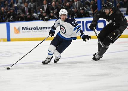 Apr 16, 2022; Tampa, Florida, USA; Winnipeg Jets left wing Nikolaj Ehlers (27) attempts to get past Tampa Bay Lightning defenseman Victor Hedman (77) in the second period  at Amalie Arena. Mandatory Credit: Jonathan Dyer-USA TODAY Sports
