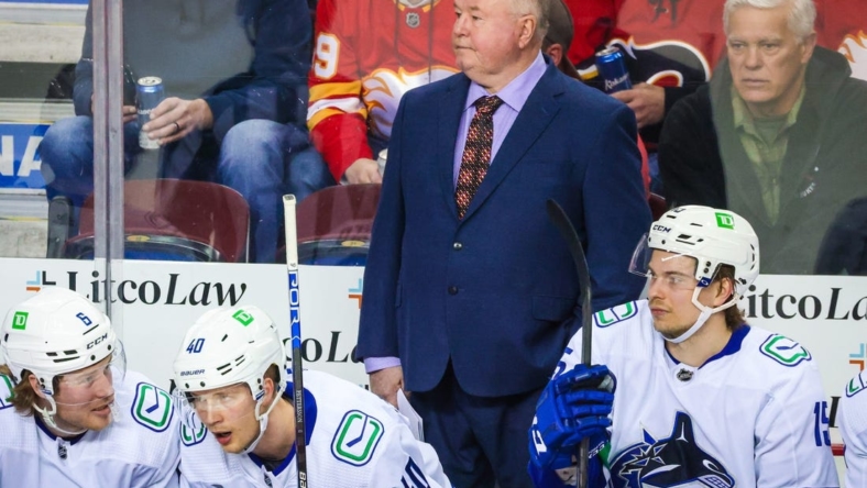 Apr 23, 2022; Calgary, Alberta, CAN; Vancouver Canucks head coach Bruce Boudreau on his bench during the first period against the Calgary Flames at Scotiabank Saddledome. Mandatory Credit: Sergei Belski-USA TODAY Sports
