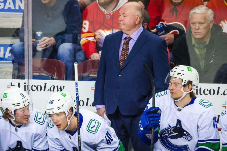 Apr 23, 2022; Calgary, Alberta, CAN; Vancouver Canucks head coach Bruce Boudreau on his bench during the first period against the Calgary Flames at Scotiabank Saddledome. Mandatory Credit: Sergei Belski-USA TODAY Sports