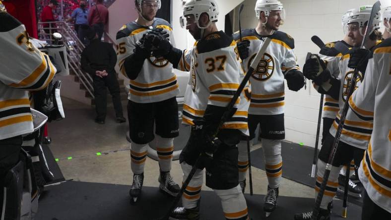 May 14, 2022; Raleigh, North Carolina, USA; Boston Bruins center Patrice Bergeron (37) goes out onto the ice against the Carolina Hurricanes at the start of the second period in game seven of the first round of the 2022 Stanley Cup Playoffs at PNC Arena. Mandatory Credit: James Guillory-USA TODAY Sports