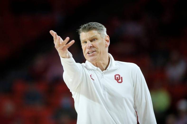 Oklahoma coach Porter Moser shouts during a men's Big 12 basketball game between the University of Oklahoma Sooners (OU) and the West Virginia Mountaineers at Lloyd Noble Center in Norman, Okla., Tuesday, March 1, 2022. Oklahoma won 72-59.

cutout