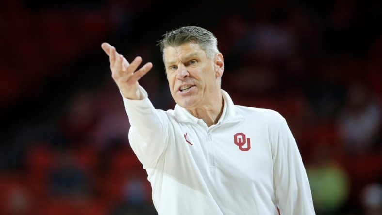 Oklahoma coach Porter Moser shouts during a men's Big 12 basketball game between the University of Oklahoma Sooners (OU) and the West Virginia Mountaineers at Lloyd Noble Center in Norman, Okla., Tuesday, March 1, 2022. Oklahoma won 72-59.

cutout