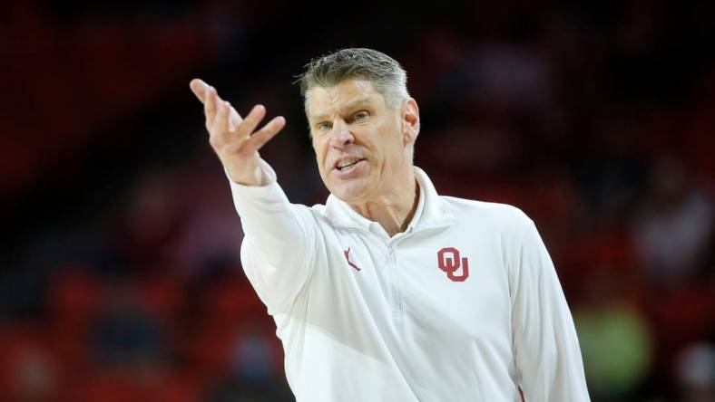 Oklahoma coach Porter Moser shouts during a men's Big 12 basketball game between the University of Oklahoma Sooners (OU) and the West Virginia Mountaineers at Lloyd Noble Center in Norman, Okla., Tuesday, March 1, 2022. Oklahoma won 72-59.

cutout