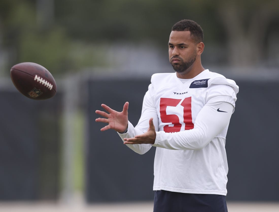 May 24, 2022; Houston, Texas, USA; Houston Texans line backer Kamu Grugier-Hill (51) plays catch with another teammate during organized team activities at the Houston Texans practice field. Mandatory Credit: Thomas Shea-USA TODAY Sports