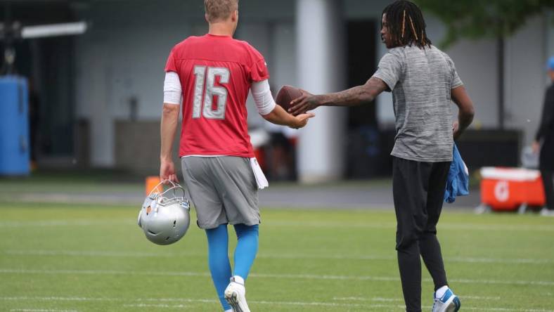 Lions quarterback Jared Goff, left, and receiver Jameson Williams play walk off the field after playing catch after practice during minicamp on Thursday, June 9, 2022, in Allen Park.

Lions