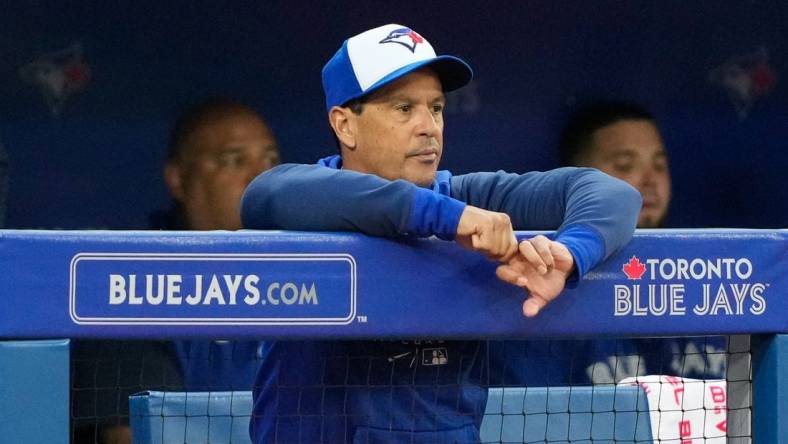 Jun 29, 2022; Toronto, Ontario, CAN; Toronto Blue Jays manager Charlie Montoyo (25) looks on from the dugout against the Boston Red Sox at Rogers Centre. Mandatory Credit: Kevin Sousa-USA TODAY Sports