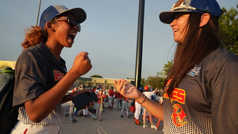 Riley Wilson, 14, left, and Laney Fukuoka, 15, California teammates on the Hurricanes share a laugh during the opening ceremony for Baseball for All, an organization focused on giving girls an opportunity to play baseball, at Hohokam Stadium in Mesa, Ariz. on Wednesday, July 20, 2022.

Baseball For All 17
