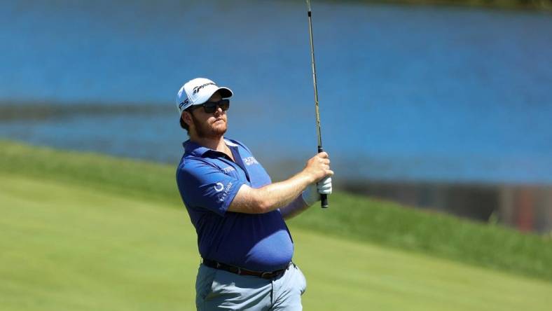 Jul 21, 2022; Blaine, Minnesota, USA; Harry Higgs hits an approach shot from the fairway on the 7th hole during the first round of the 3M Open golf tournament. Mandatory Credit: Matt Krohn-USA TODAY Sports