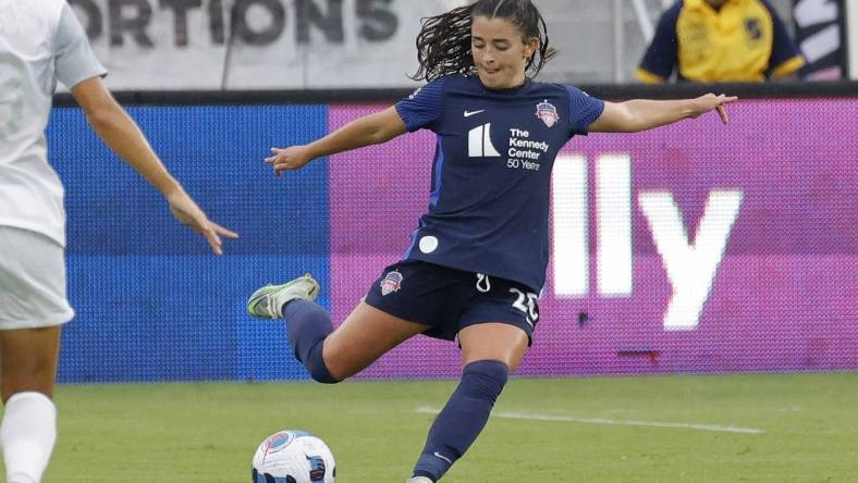 Jul 17, 2022; Washington, District of Columbia, USA; Washington Spirit midfielder Marissa Sheva (25) kicks the ball against Orlando Pride at Audi Field. Mandatory Credit: Geoff Burke-USA TODAY Sports