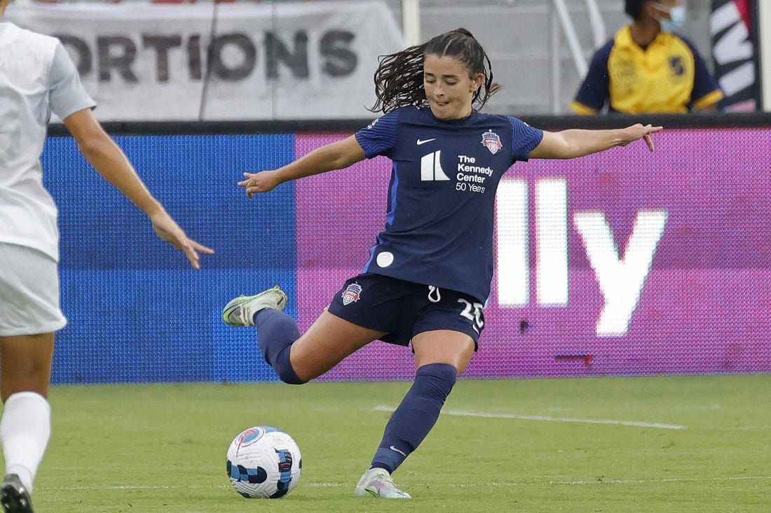 Jul 17, 2022; Washington, District of Columbia, USA; Washington Spirit midfielder Marissa Sheva (25) kicks the ball against Orlando Pride at Audi Field. Mandatory Credit: Geoff Burke-USA TODAY Sports