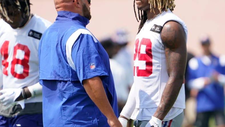 New York Giants head coach Brian Daboll, left, talks to safety Xavier McKinney (29) during the second day of training camp at the Quest Diagnostics Training Center in East Rutherford on Thursday, July 28, 2022.

Football Giants Training Camp