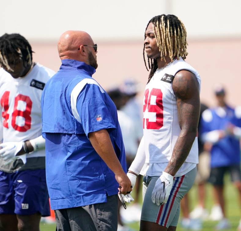 New York Giants head coach Brian Daboll, left, talks to safety Xavier McKinney (29) during the second day of training camp at the Quest Diagnostics Training Center in East Rutherford on Thursday, July 28, 2022.

Football Giants Training Camp