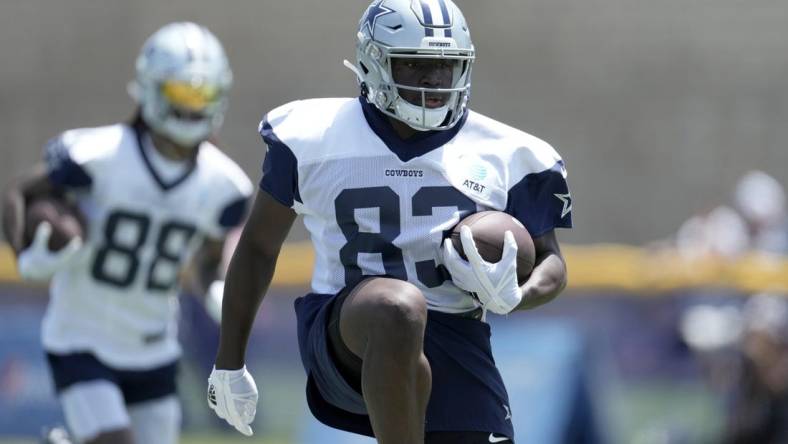 Jul 27, 2022; Oxnard, CA, USA; Dallas Cowboys receiver James Washington (83) carries the ball during training camp at the River Ridge Fields. Mandatory Credit: Kirby Lee-USA TODAY Sports