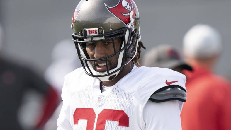 Aug 17, 2022; Nashville, Tennessee;  Tampa Bay Buccaneers safety Logan Ryan (26) warms up during a joint training camp practice against the Tennessee Titans at Ascension Saint Thomas Sports Park.  Mandatory Credit: George Walker IV-USA TODAY Sports