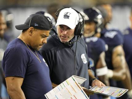 Aug 20, 2022; Toronto, Ontario, CAN; Toronto Argonauts head coach Ryan Dinwiddie talks to injured running back Andrew Harris (left) during the second half against the Calgary Stampeders at BMO Field. Mandatory Credit: John E. Sokolowski-USA TODAY Sports