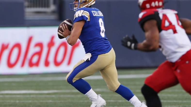 Aug 25, 2022; Winnipeg, Manitoba, CAN;  Winnipeg Blue Bombers quarterback Zach Collaros (8) looks for a receiver during the first half against the Calgary Stampeders at IG Field. Mandatory Credit: Bruce Fedyck-USA TODAY Sports