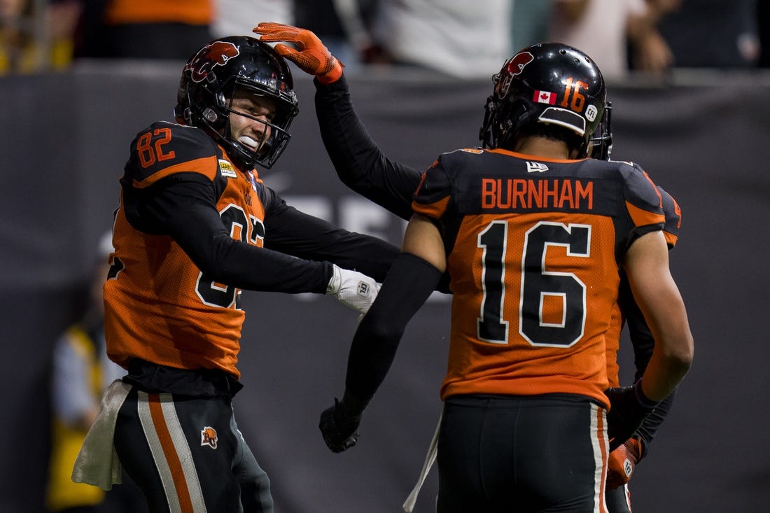 Aug 26, 2022; Vancouver, British Columbia, CAN; BC Lions wide receiver Jacob Scarfone (82) celebrates his touchdown with wide receiver Bryan Burnham (16) in the second half against the Saskatchewan Roughriders at BC Place. Mandatory Credit: Bob Frid-USA TODAY Sports