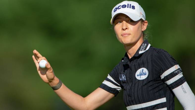 Aug 27, 2022; Ottawa, Ontario, CAN; Nelly Korda finishes up the 18th hole during the third round of the CP Women's Open golf tournament. Mandatory Credit: Marc DesRosiers-USA TODAY Sports